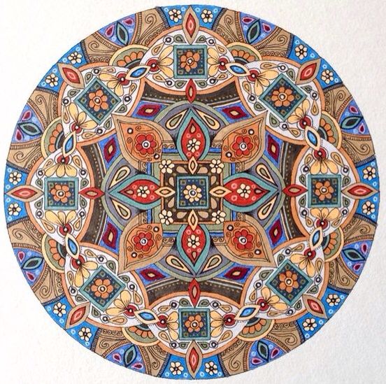 Ornate circular mandala with symmetrical geometric patterns in blue, red, orange and beige