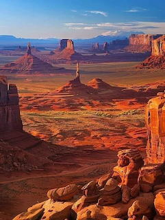Red rock buttes and mesas in Monument Valley under a blue sky