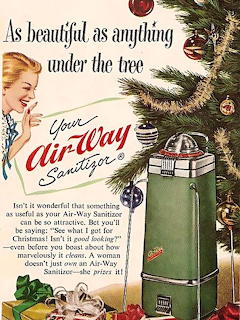 Vintage Air-Way vacuum cleaner Christmas advertisement with woman and decorated tree