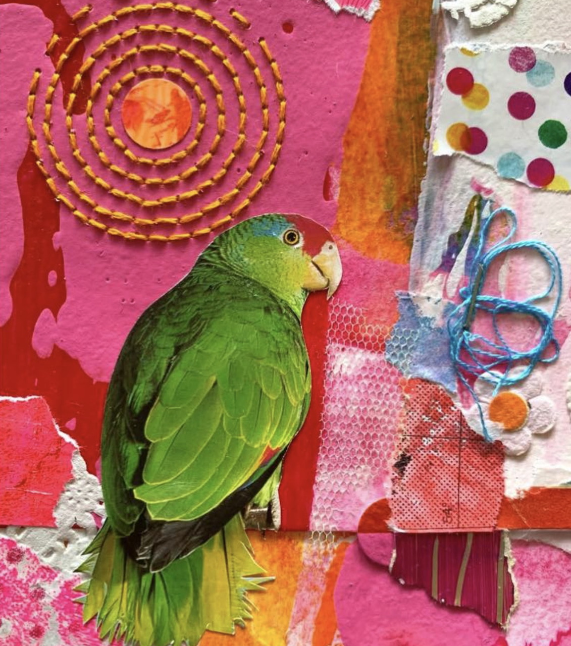 Green parrot on a colorful pink mixed media collage with stitched spiral and polka dot patterns
