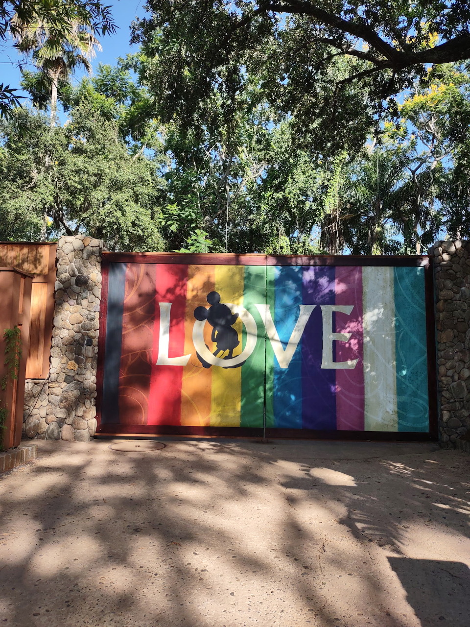 Disney characters illustrated with rainbow Pride colors