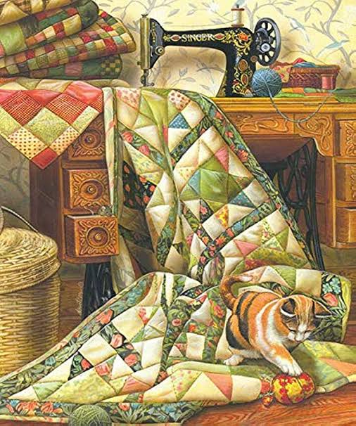 Tabby cat composed of colorful patchwork quilt squares sits next to antique sewing machine with thread spools and quilts