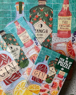 Colorful illustrated collage of gin bottles with citrus and botanical decorative elements