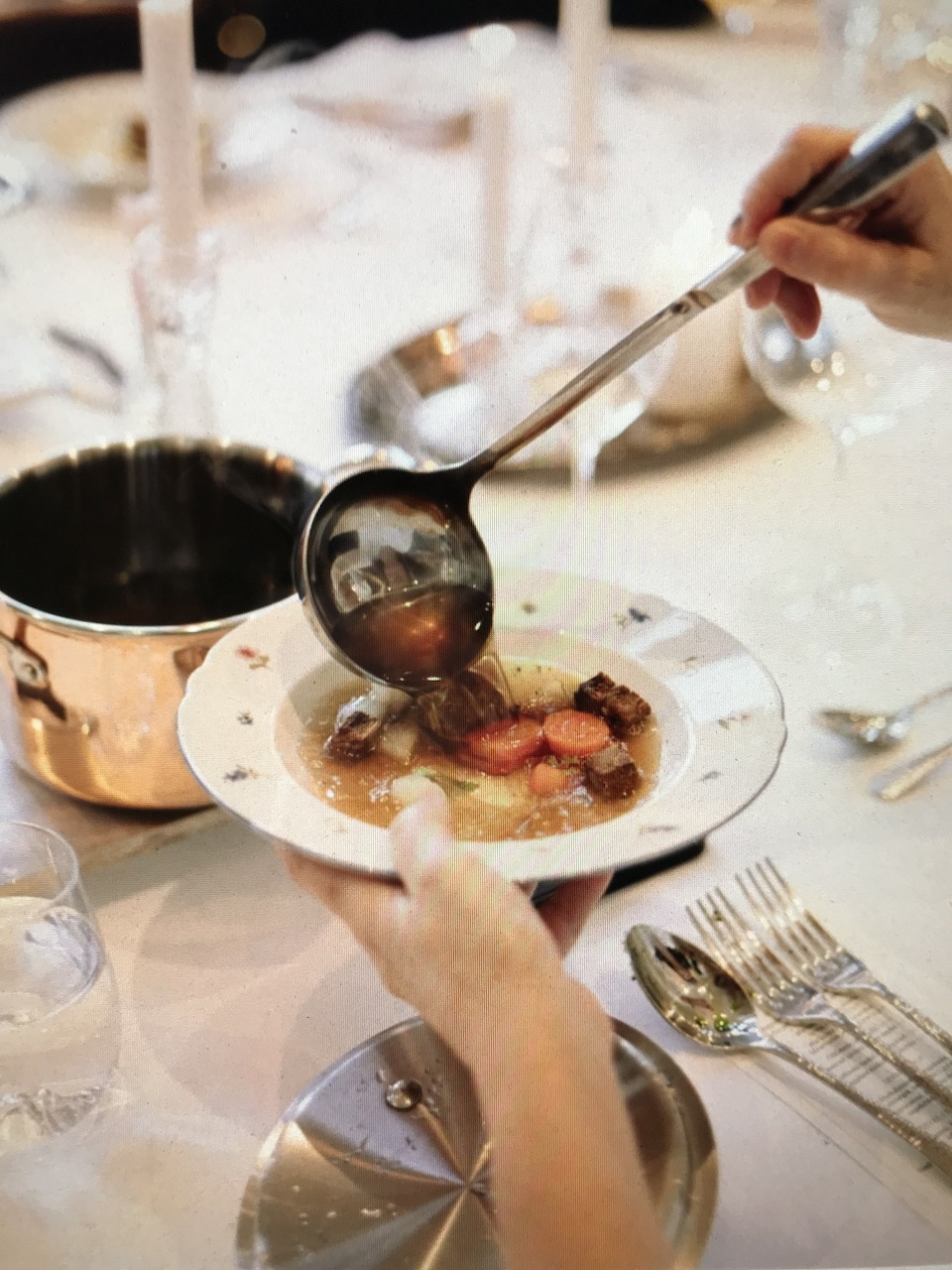 Ladling Soup from Copper Pot