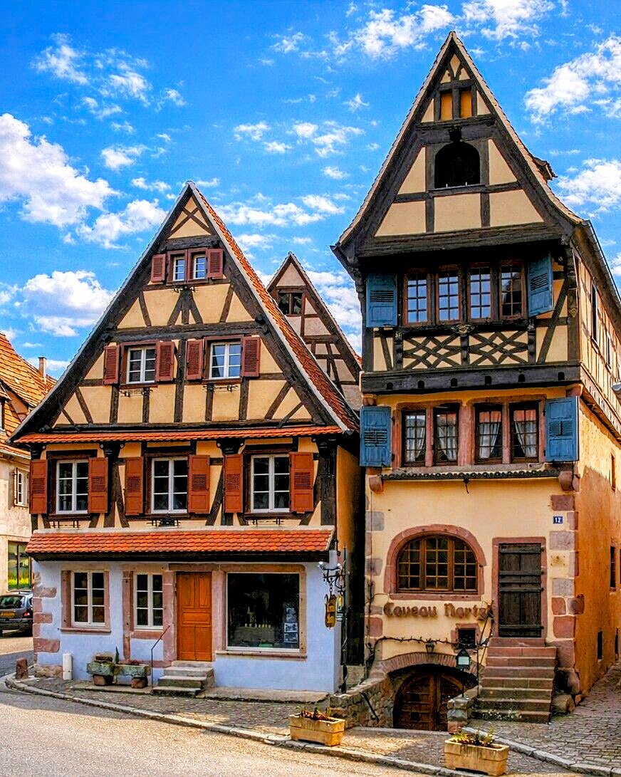 Half-timbered houses along a cobblestone street in Dambach-la-Ville, Alsace