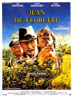 Jean de Florette movie poster showing two men in countryside with sunflowers and blue sky