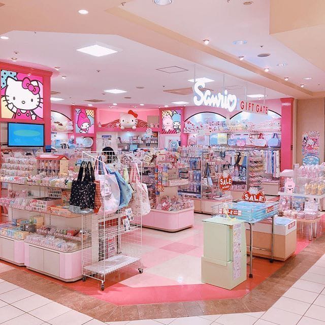 Pink Sanrio store interior with Hello Kitty products and colorful merchandise displays