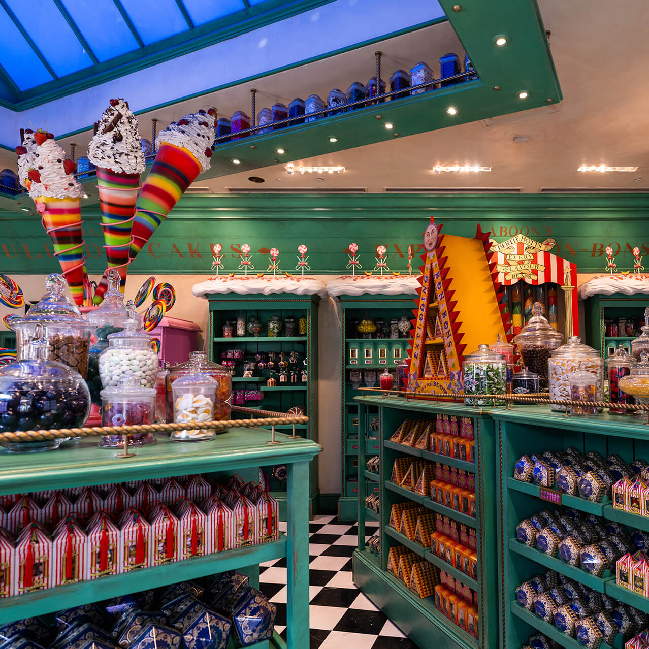 Colorful candy shop interior with green shelves, giant lollipops, glass jars, and assorted sweets on display