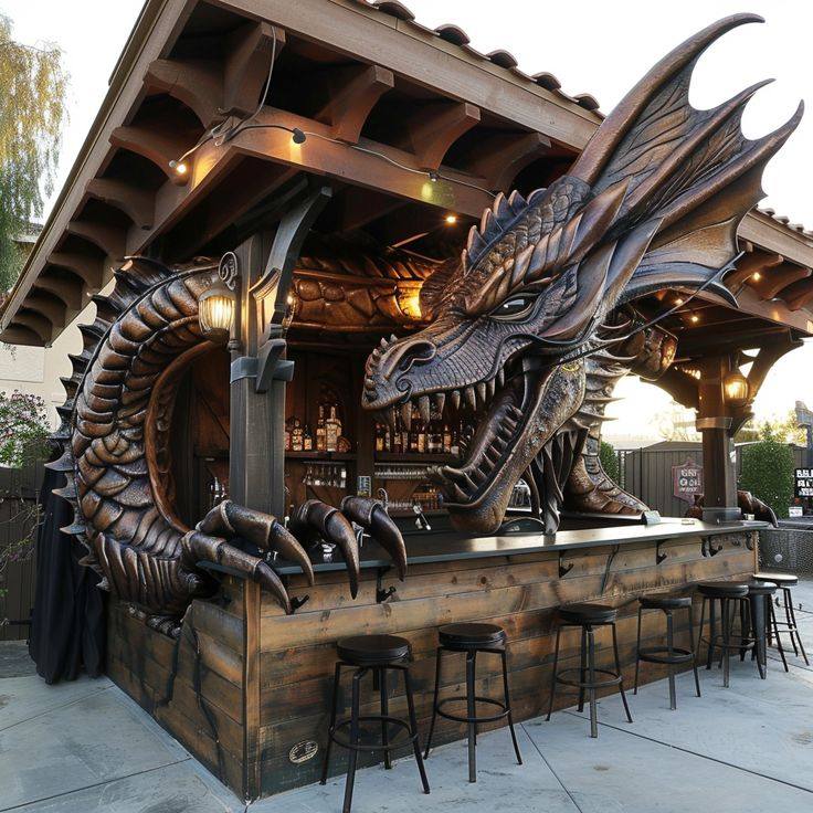 Large metal dragon sculpture coiled around wooden outdoor bar with stools and bottles