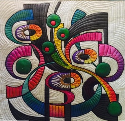 Abstract quilted textile art with colorful curved geometric shapes and circular patterns on white background