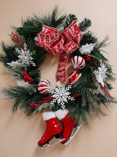 Decorative holiday wreath with evergreen and ornaments