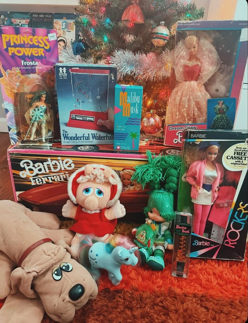Collection of vintage toys and dolls with colorful packaging and stuffed animals