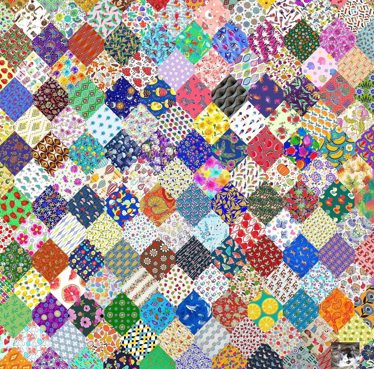 Colorful patchwork quilt made of many small patterned fabric squares in rainbow colors