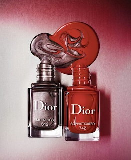Two Dior nail polish bottles, one metallic grey (612) and one deep red (742), with color swirls above