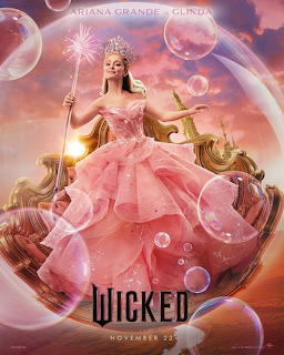Glinda from Wicked in ornate pink ball gown holding wand, floating bubbles, golden sunset backdrop