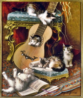 Kittens Playing With a Guitar