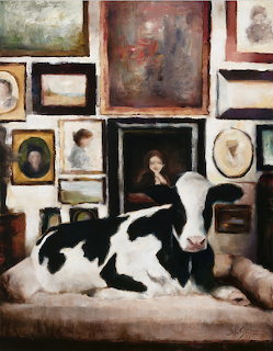 Painting of a black and white cow lying on a sofa beneath a wall of framed pictures