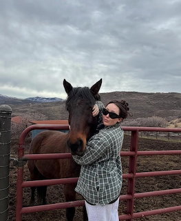 Woman with Horse at Fence