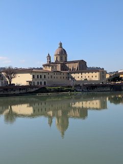 Church of San Frediano in Cestello with dome reflected in the Arno River, Florence