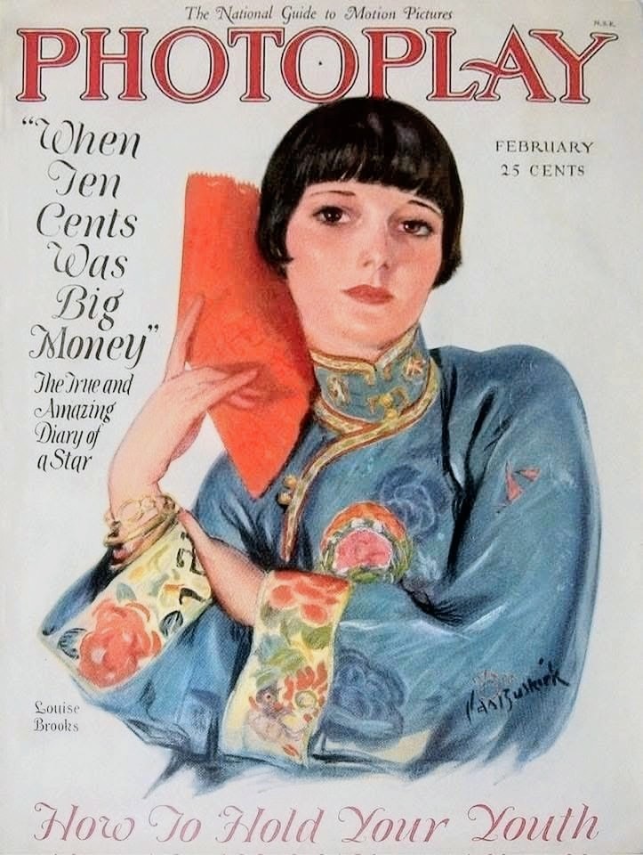 Vintage Photoplay magazine cover from February 1927 showing Louise Brooks in a blue floral top with red fan
