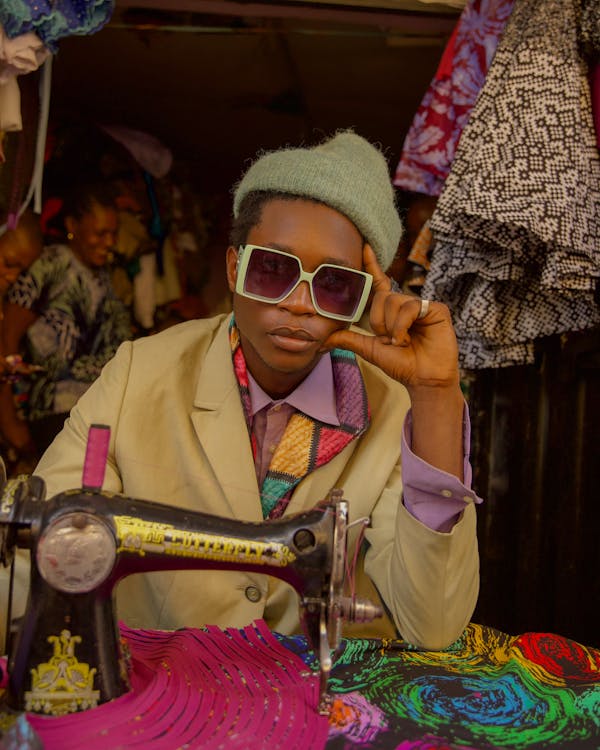 Woman in colorful clothes standing at an outdoor bazaar market