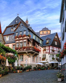 Traditional half-timbered buildings line a cobblestone street in historic Beilstein, Germany