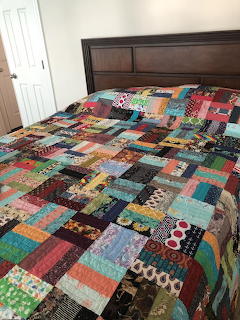 Patchwork Quilt on Bed
