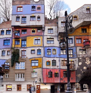 Hundertwasser House in Vienna with colorful irregular facades and varied window patterns