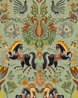 Symmetrical folk art design with two black horses, colorful flowers, birds, and ornate scrollwork on green background
