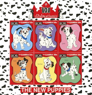Six colorful postage stamps showing dalmatian puppies arranged in decorative red frame with spotted pattern border