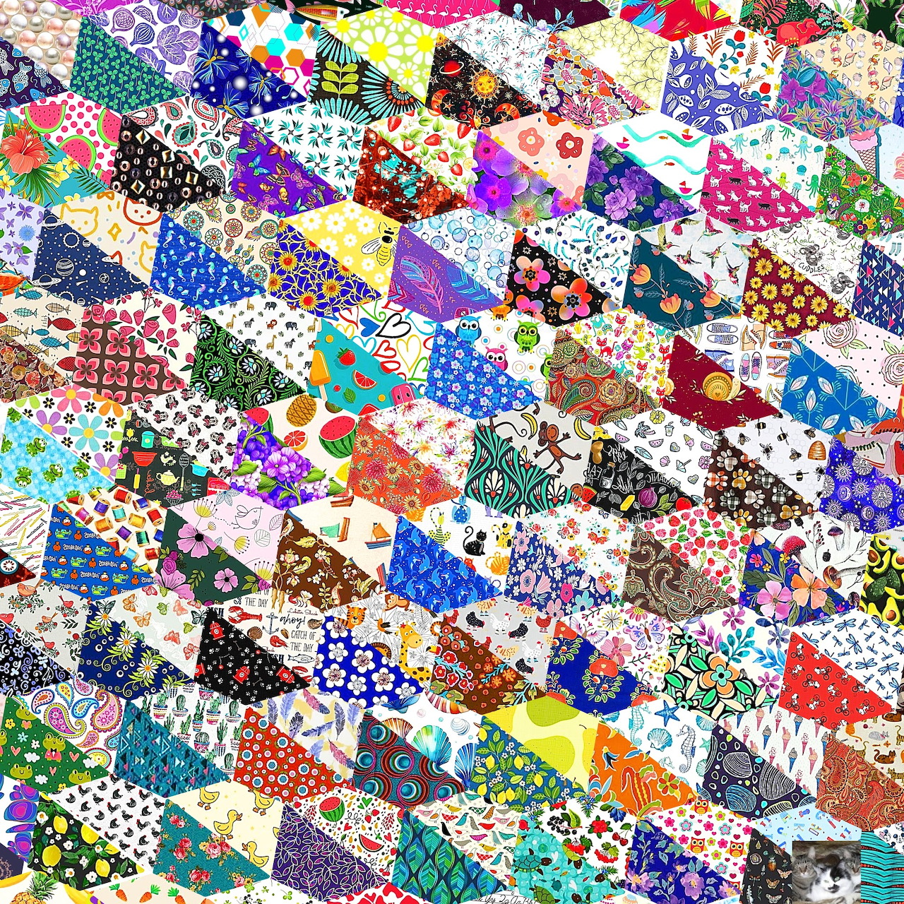 Dense colorful patchwork quilt with varied fabric patterns and geometric shapes