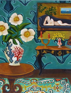 White flowers in decorative vase on gold table against teal patterned wall with ornate furniture