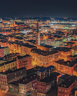 Aerial nightime view of Over-the-Rhine neighborhood with historic brick buildings and city lights