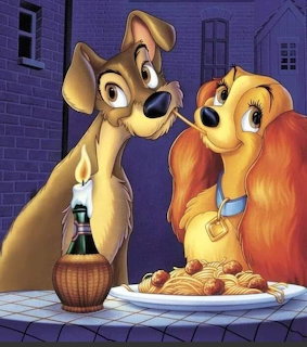 Two cartoon dogs sitting at a table with spaghetti and a candle bottle in a dim alleyway