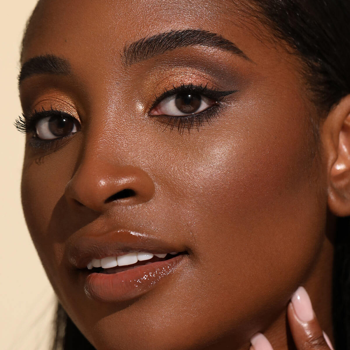 Close-up portrait of woman with natural makeup and brown eyes