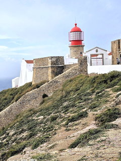 Lighthouse on Rocky Cliff
