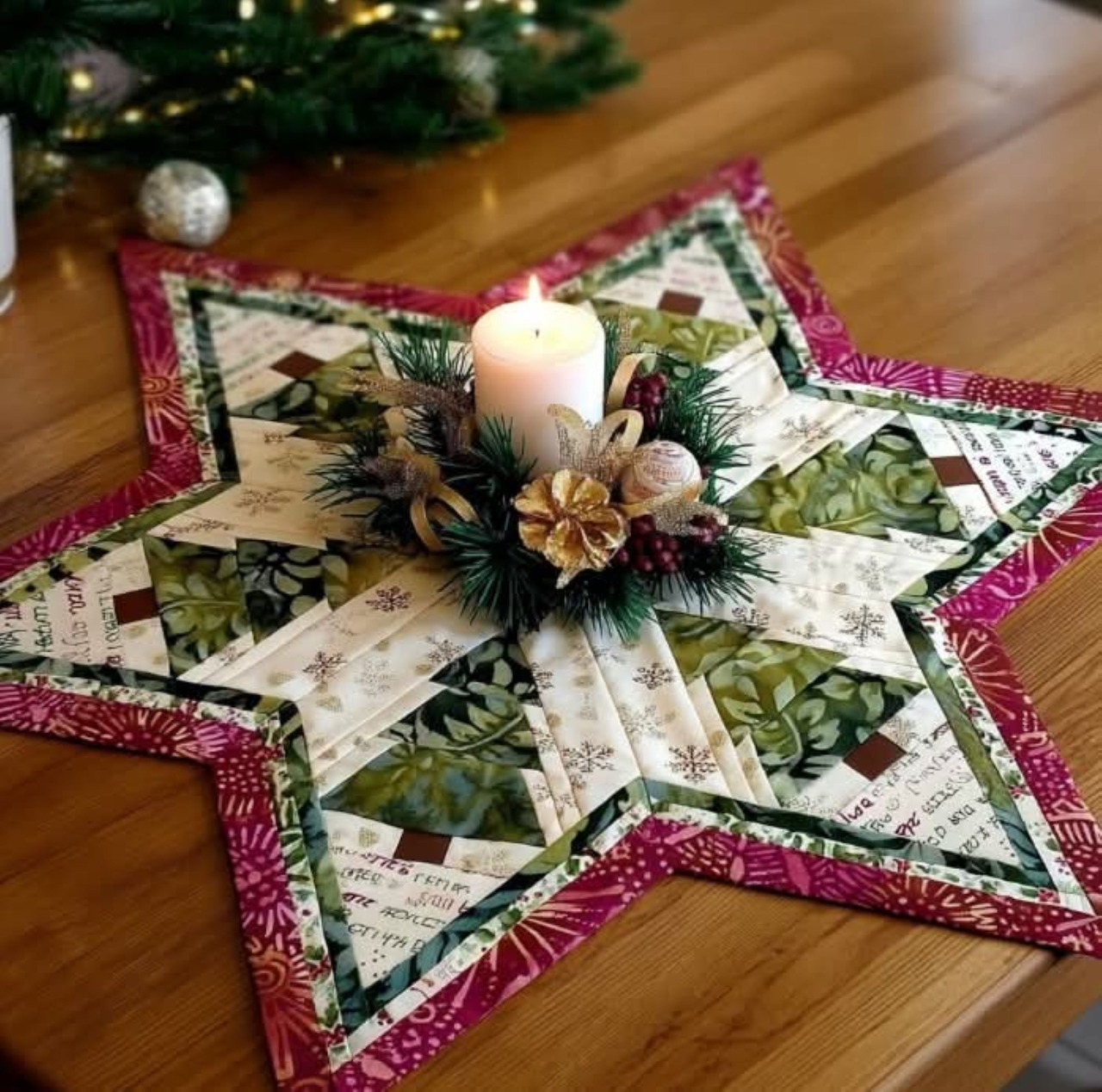 Star-shaped quilted table runner with Christmas greenery and candle centerpiece