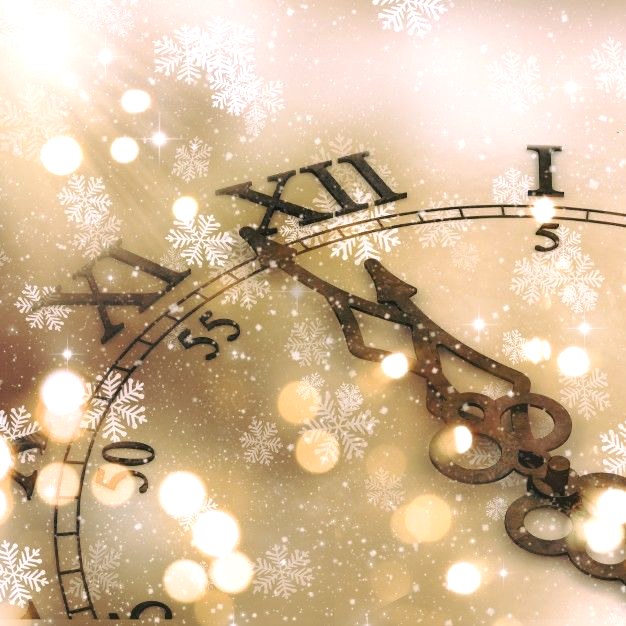 Close-up of a decorative clock with snowflakes and golden festive bokeh lights