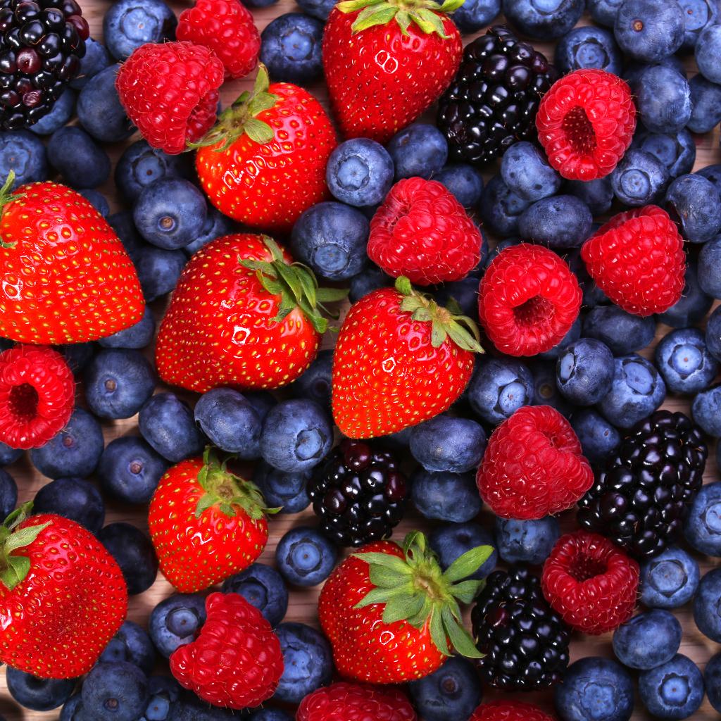 Close-up of mixed fresh berries including strawberries, blueberries, raspberries, and blackberries