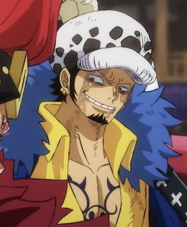 Anime character in spotted hat and yellow coat with blue fur collar, smiling