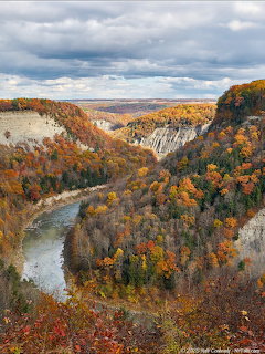 Autumn gorge landscape with a winding river and waterfall at Letchworth State Park