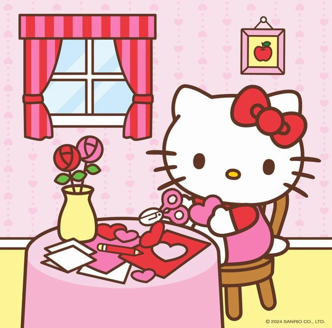 Hello Kitty cartoon character drawing at a pink table in a decorated room
