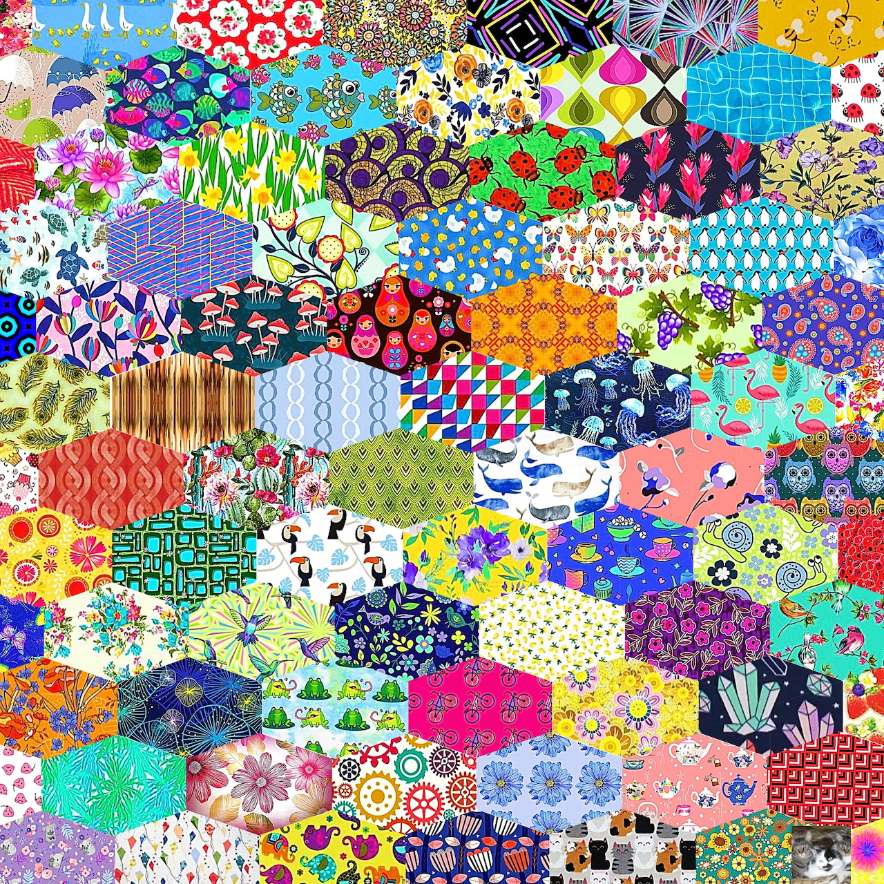 Colorful patchwork quilt with diverse fabric patterns including florals, dots, and geometric designs