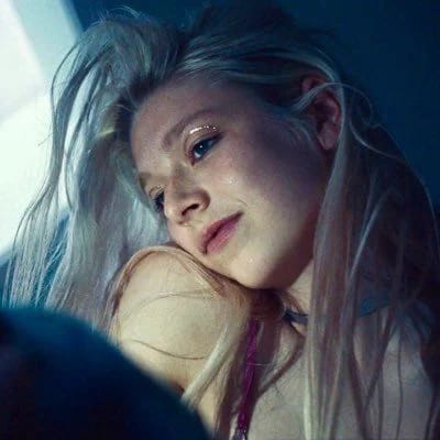 Portrait of a young woman with light hair and a calm expression