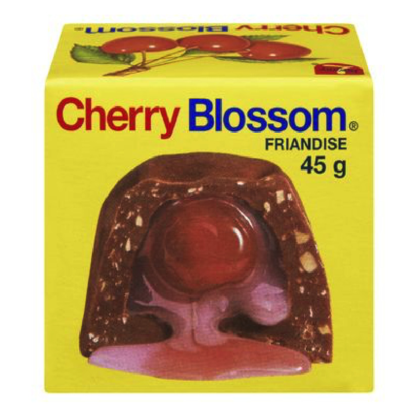 Cherry Blossom chocolate candy box, 45g, showing chocolate treat through clear window on yellow packaging