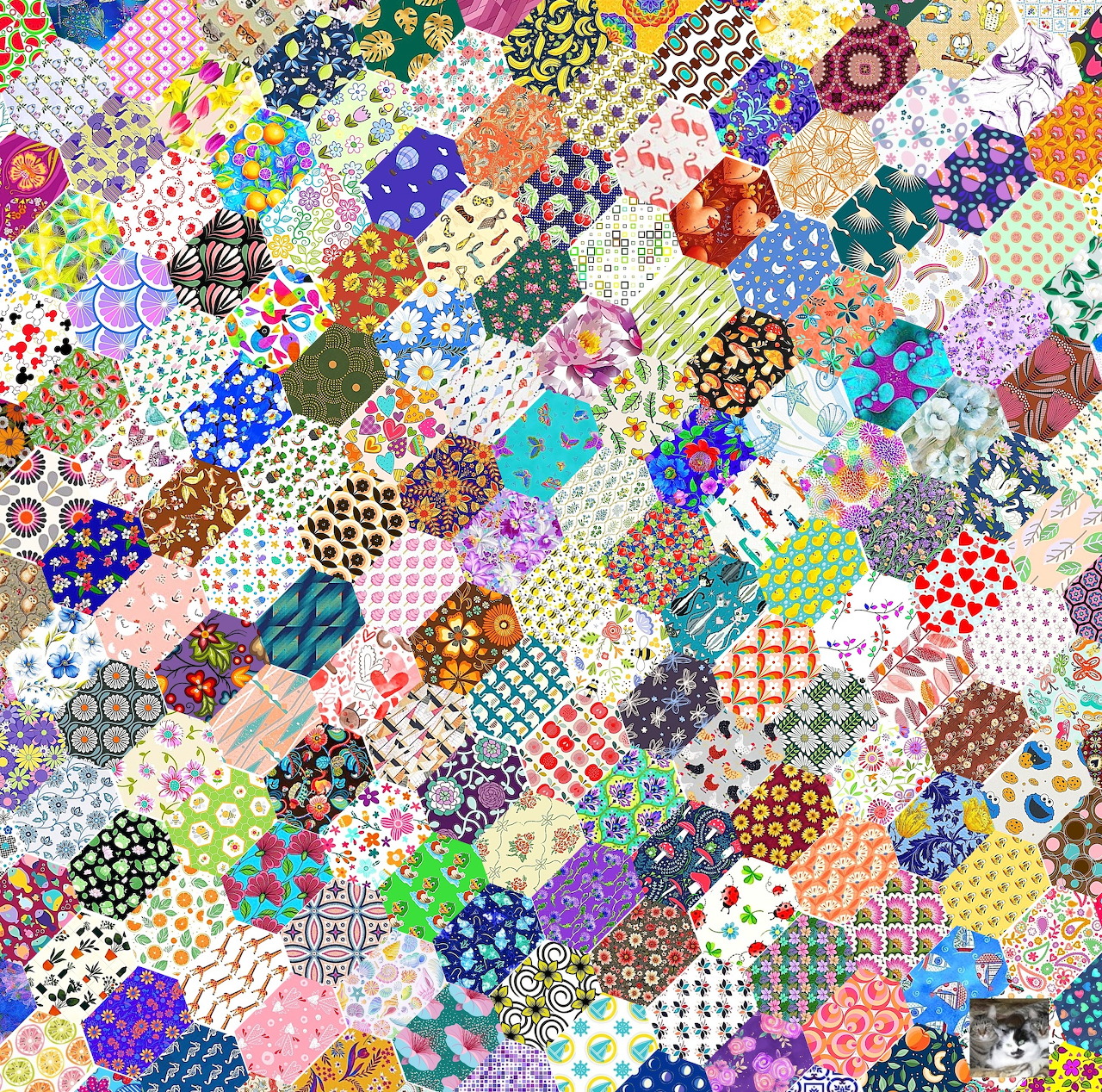 Colorful hexagonal patchwork quilt with various fabric patterns and prints