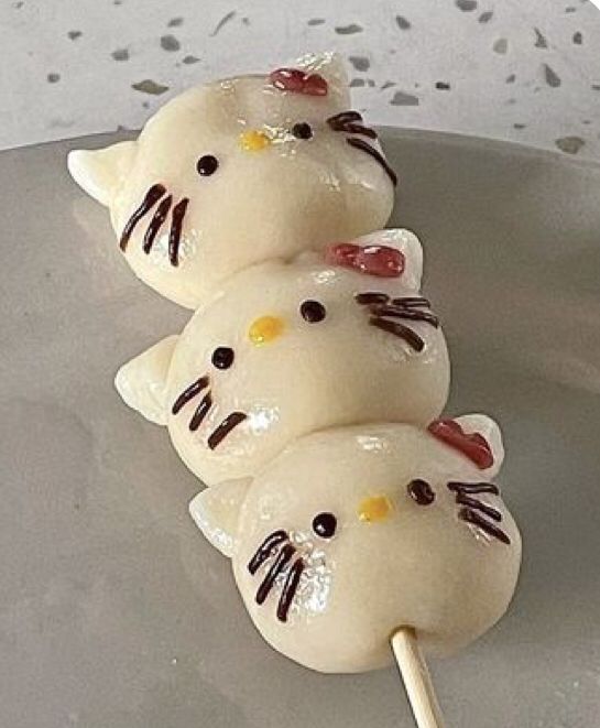 Cute kawaii mochi cats with pink bows in pastel colors