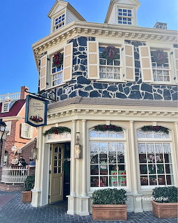 Ye Olde Christmas Shoppe building with stone facade and holiday decorations at Magic Kingdom