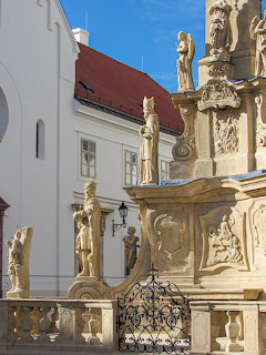 Ornate baroque Holy Trinity statue with religious figures in Veszprém town square, Hungary