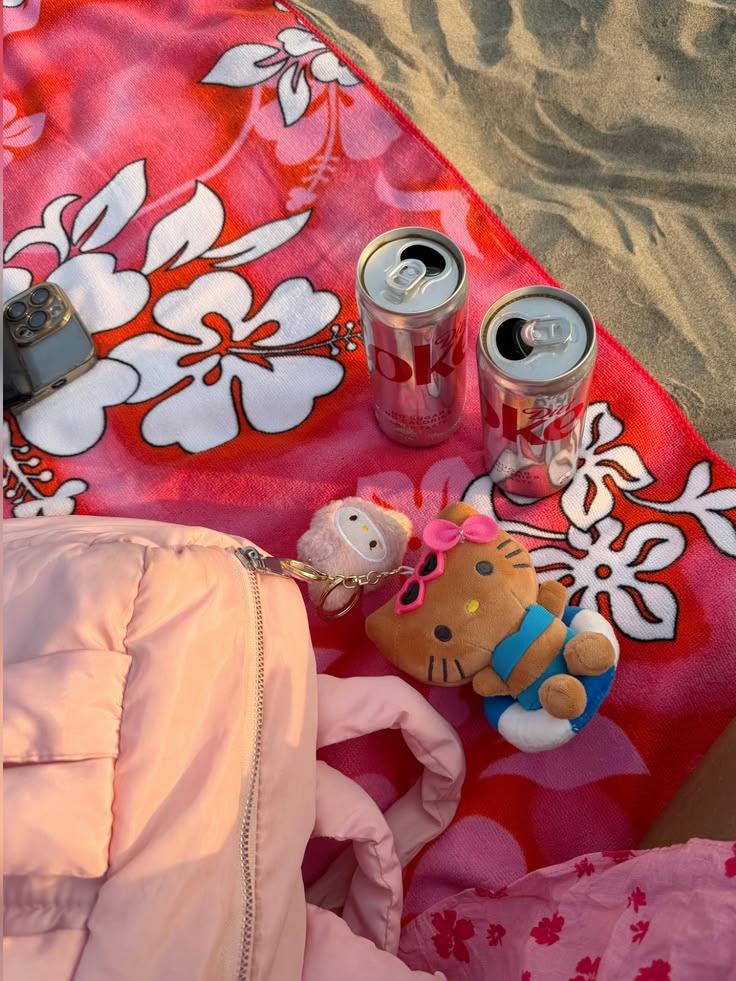 Hello Kitty character on a tropical beach with palm trees and ocean